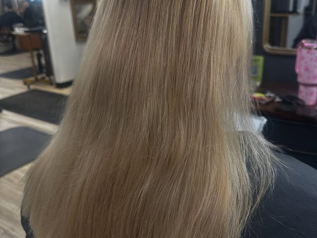Long cool-toned ash blonde by Craft Collective Salon Group