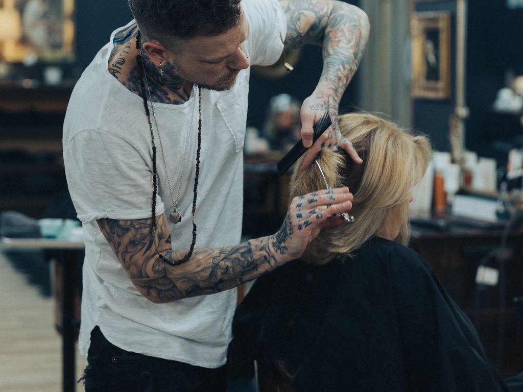Derek Piekarski cutting a client's hair at the Craft Collective studio in Pittsburgh's North Hills