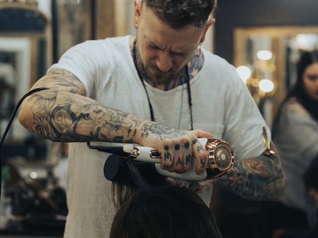Derek Piekarski styling a client at Craft Collective Salon Group